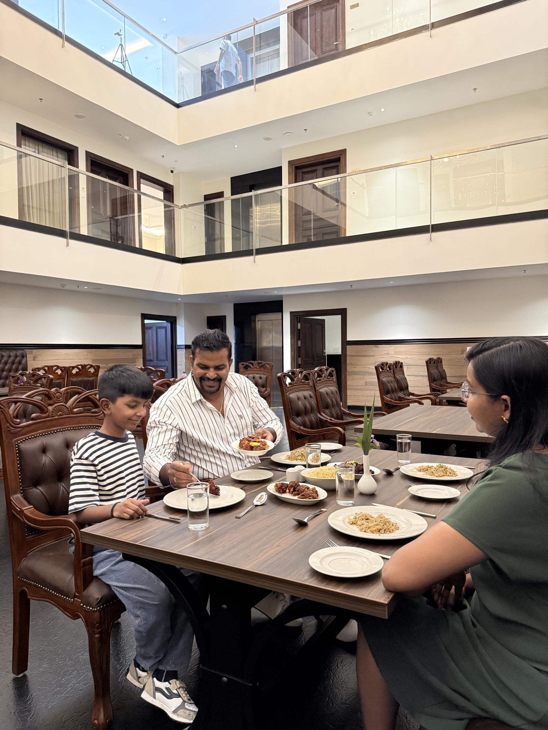Family dining in the atrium